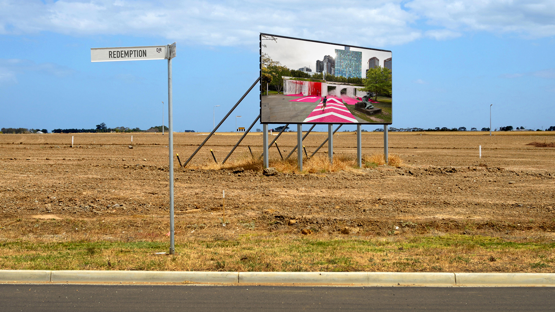 A billboard in farmland that is being transformed into a new suburb